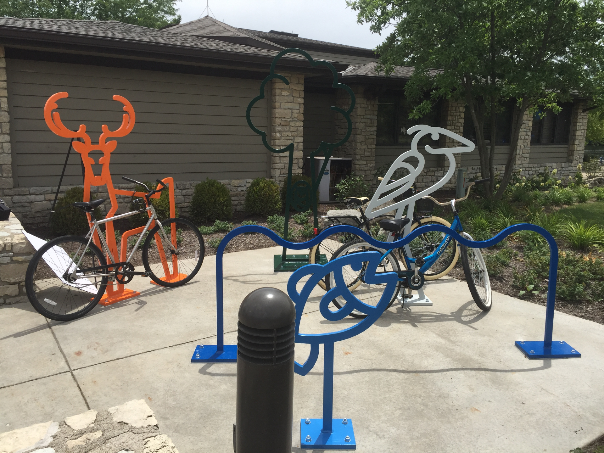 Custom animal-shaped laser-cut bike racks designed in CAD