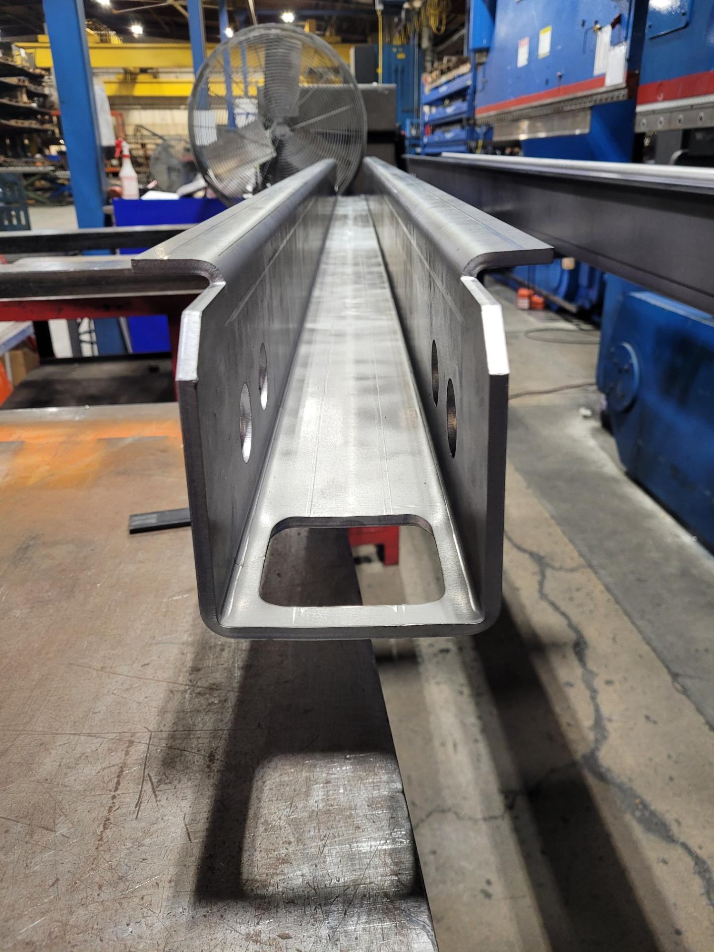 Precision formed steel channel with mounting holes
