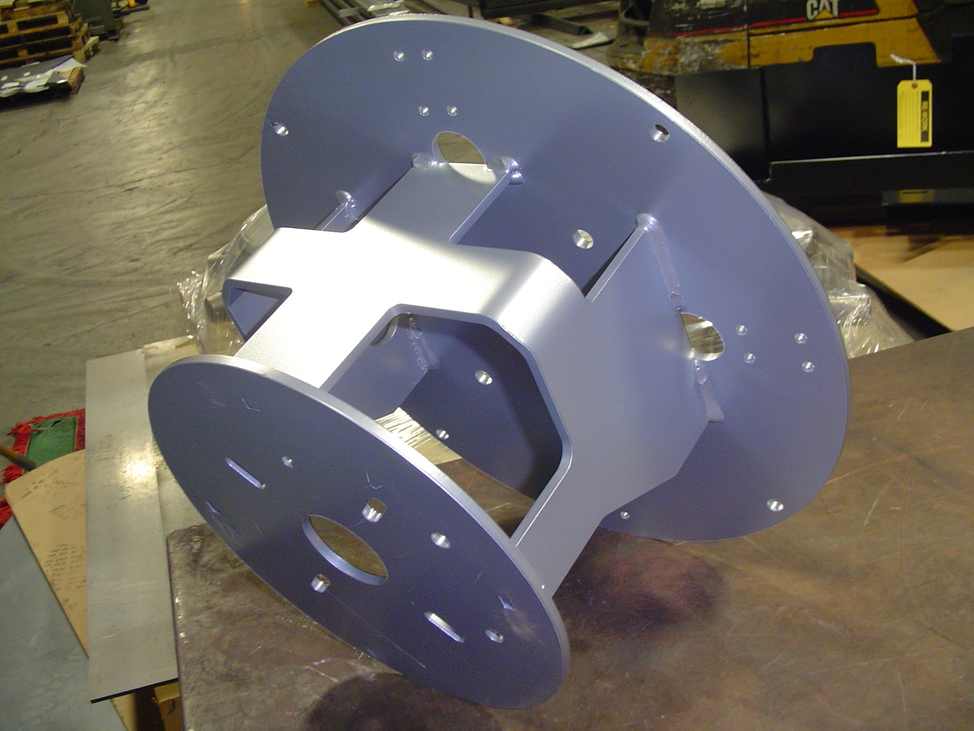 Purple powder coated robotic weldment with precision holes